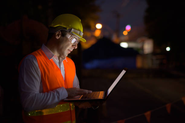 Portrait of handsome Persian man construction worker on the construction site at night