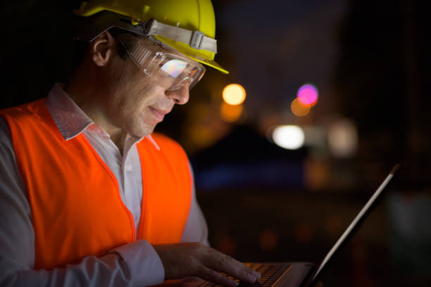istock Portrait of handsome Persian man construction worker on the construction site at night 810869640