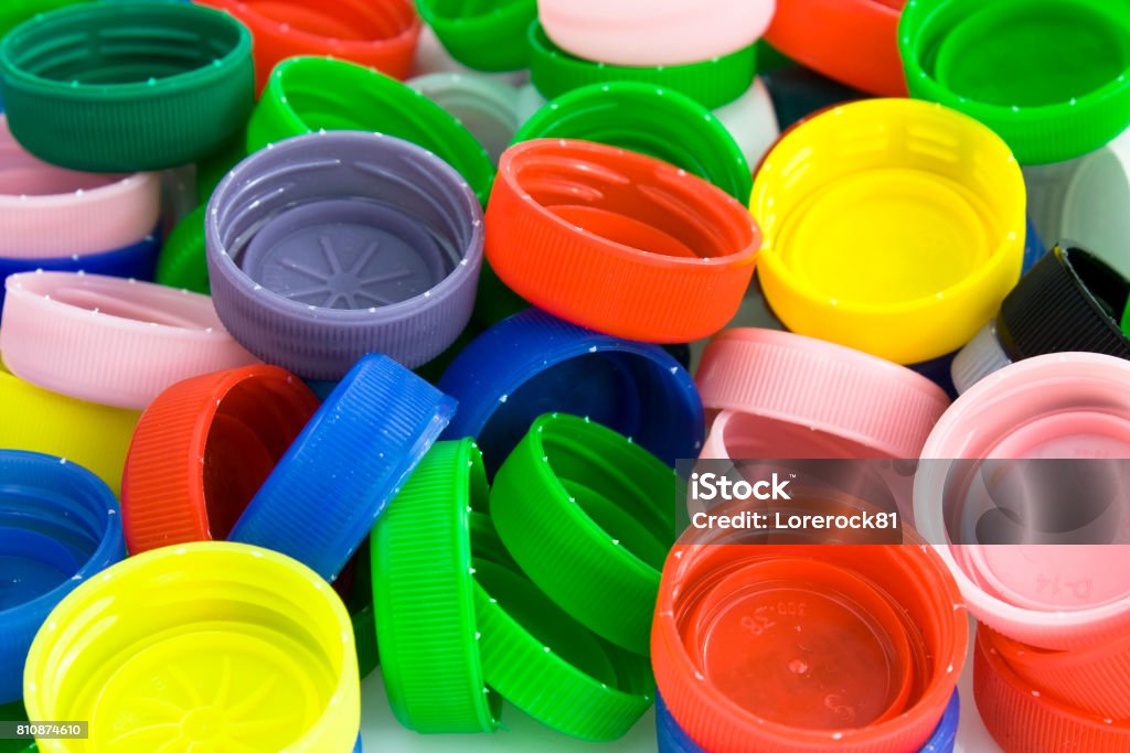 Kunststoff-Flaschenverschlüsse Hintergrund - Lizenzfrei Plastikmaterial Stock-Foto