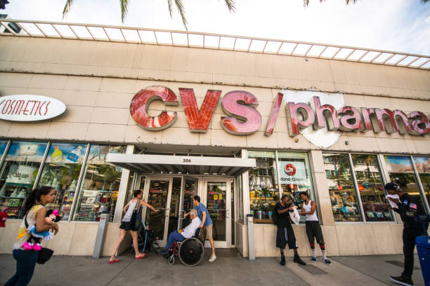 CVS Pharmacy on Lincoln Road Mall, Miami Beach, USA Miami Beach, USA - December 21, 2016: Crowds of people on Lincoln Road Mall around CVS Pharmacy entrance. convenience store stock pictures, royalty-free photos & images