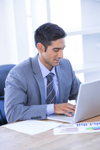 istock Businessman typing on his laptop 810886622