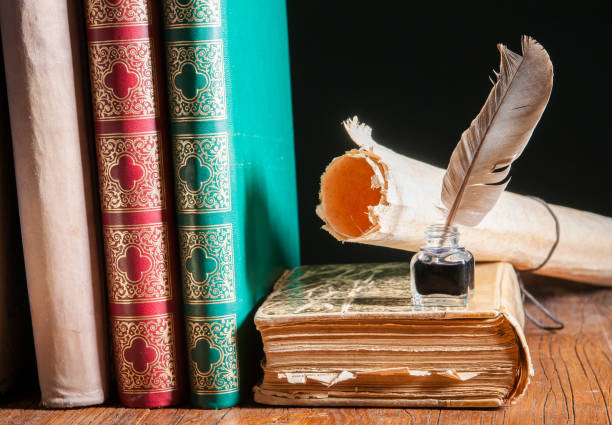istock Quill pen and old books 810886804