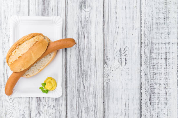 istock Wooden table with Wiener Sausages (selective focus) 810891746