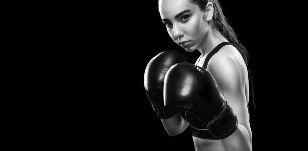 istock Sportsman muay thai boxer fighting. Isolated on black background. Copy Space. 810901094
