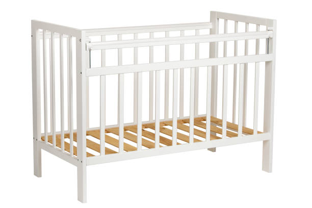 istock White crib for kids without mattress 810905628
