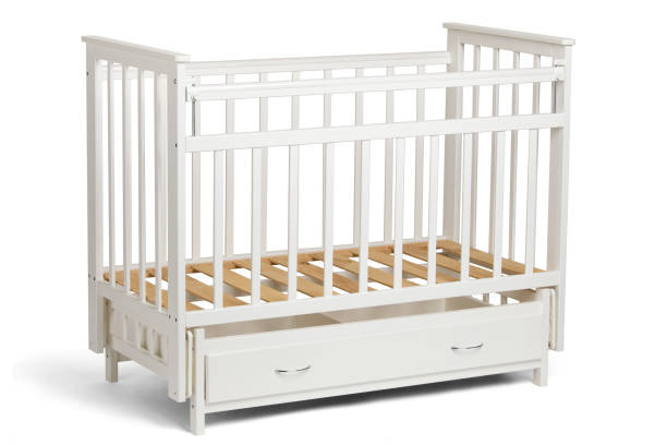istock White crib for kids without mattress 810905662