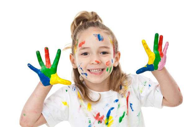 istock Cute girl with paited hands and face 810905744