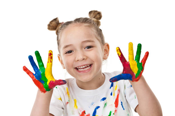istock Cute girl with paited hands and face 810905774