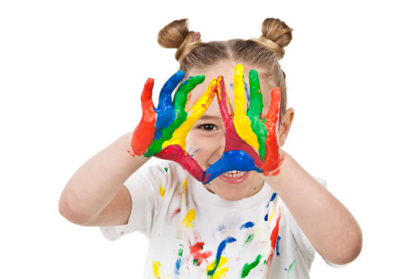 istock Cute girl with paited hands and face 810905780