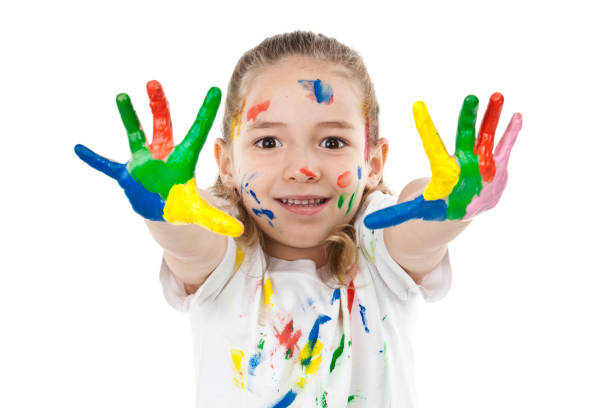 istock Cute girl with paited hands and face 810905872
