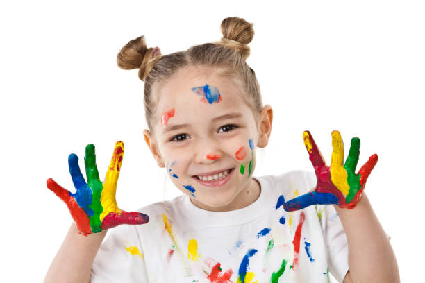 istock Cute girl with paited hands and face 810905890