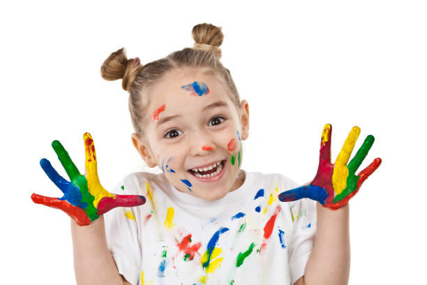 istock Cute girl with paited hands and face 810905892