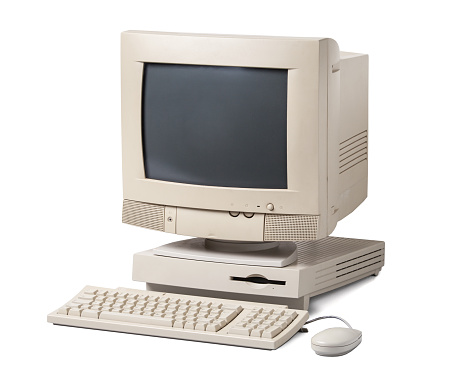 Old personal computer. The system unit, CRT monitor, keyboard and mouse isolated on white background.
