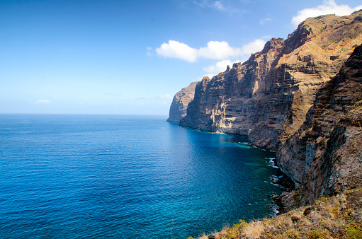 Photo of the cliffs at the Los Gigantes coast in the southern region of the island of Tenerife (Canary Islands, Tenerife).