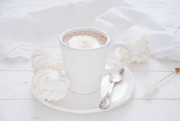 istock Coffee and marshmallow on a white wooden background 810908600