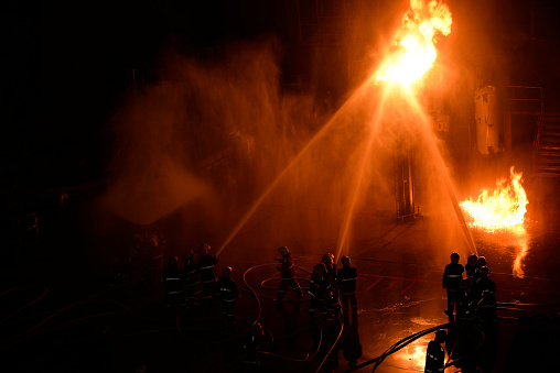 Fireman in firefighting at night.