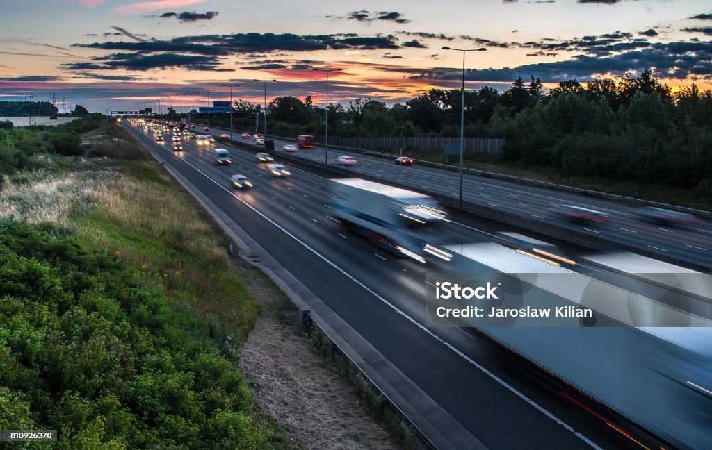 Traffic on the motorway at the dusk time UK Stock Photo