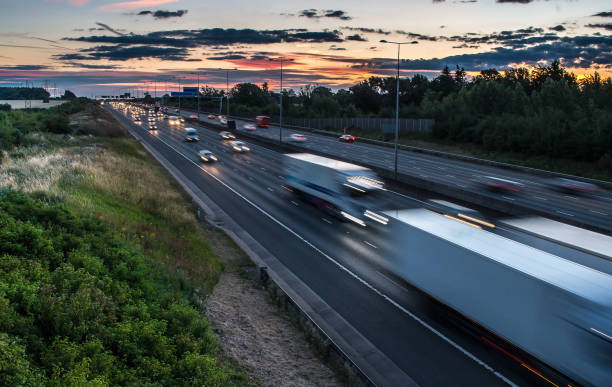 Traffic on the motorway at the dusk time Traffic on the motorway at the dusk time traffic car traffic jam uk stock pictures, royalty-free photos & images