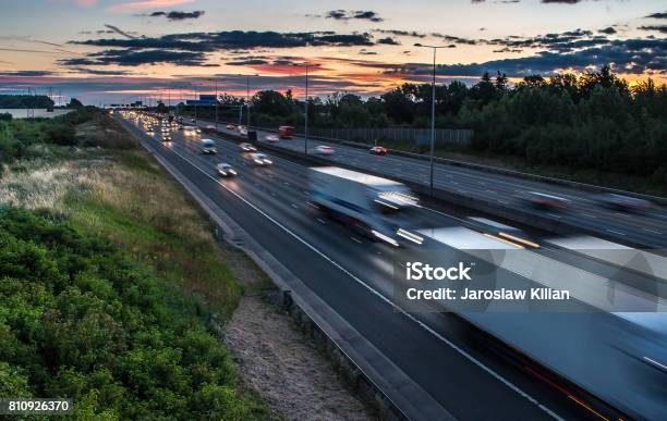 Traffic On The Motorway At The Dusk Time Stock Photo - Download Image Now - UK, Traffic Jam, Night