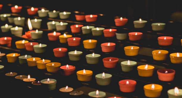 istock candle flames glowing in the dark, create a spiritual atmosphere 810933694
