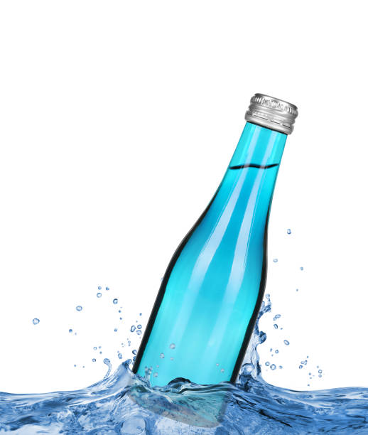 istock Bottle in water splashes on white background 810933788