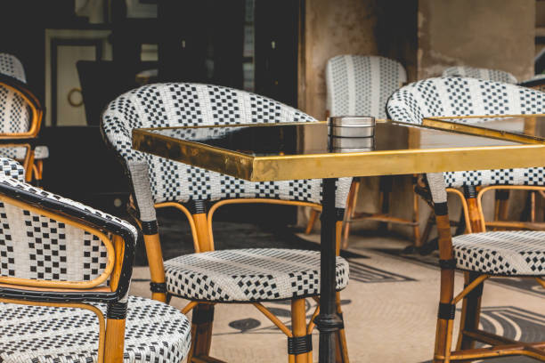 istock Parisian terrace with tables, chairs and ashtrays 810933980