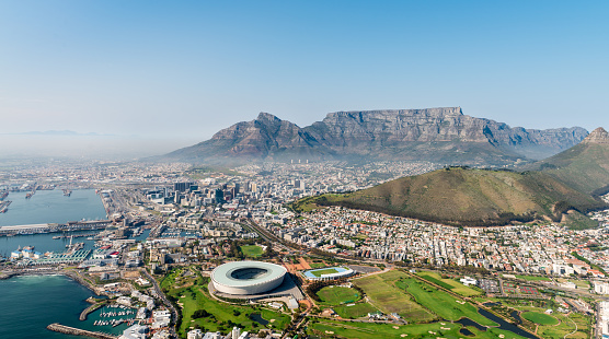 South Africa's multicoloured national flag waves in front of Cape Town's Table Mountain. Shot with Canon EOS 1Ds Mark III.