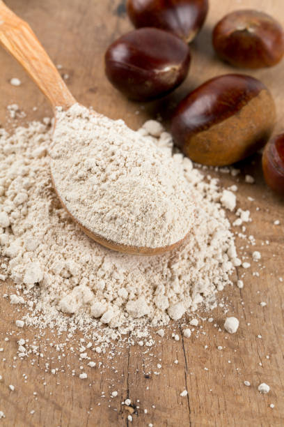 istock chestnut flour in a wooden spoon 810965404