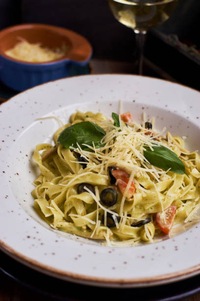 istock pasta with chicken slices and wine 810989676