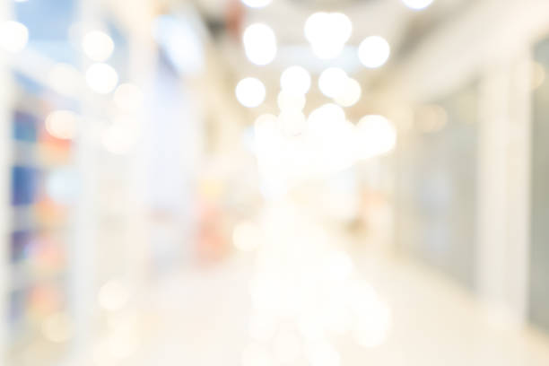 istock Blurred bokeh light in hall shopping mall colorful defocus art abstract background 810989782