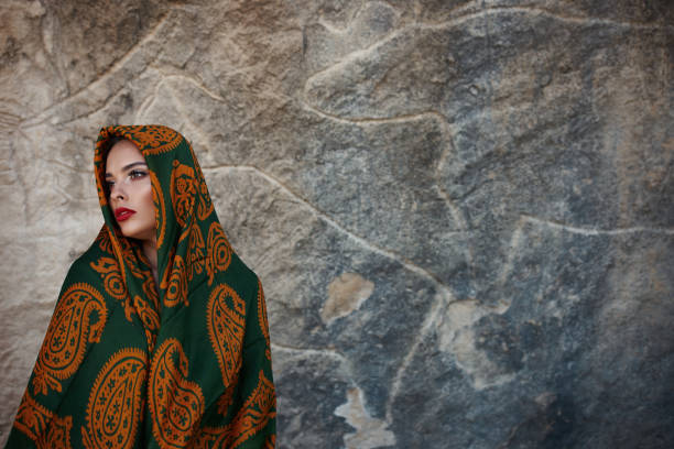 istock Young woman in oriental style clothes, studio shot. 810989888