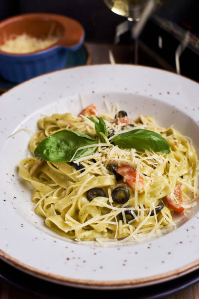 istock pasta with chicken slices and wine 810989930