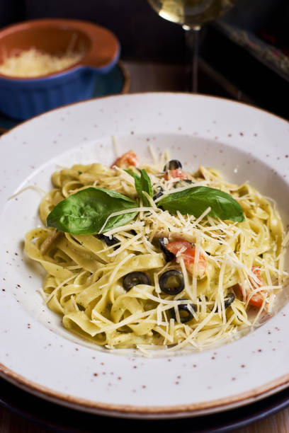istock pasta with chicken slices and wine 810990068