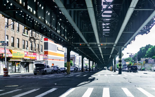 Road and street under subway railroad with restaurants and shops with sidewalk in downtown Fordham area Bronx: Road and street under subway railroad with restaurants and shops with sidewalk in downtown Fordham area 2273 stock pictures, royalty-free photos & images