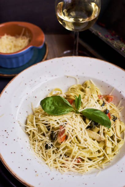 istock pasta with chicken slices and wine 810995460