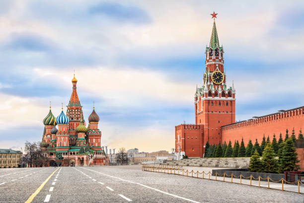 Red Square without the sun Spassky Tower and St. Basil's Cathedral on Red Square in Moscow and the colorful sky without the sun kremlin stock pictures, royalty-free photos & images