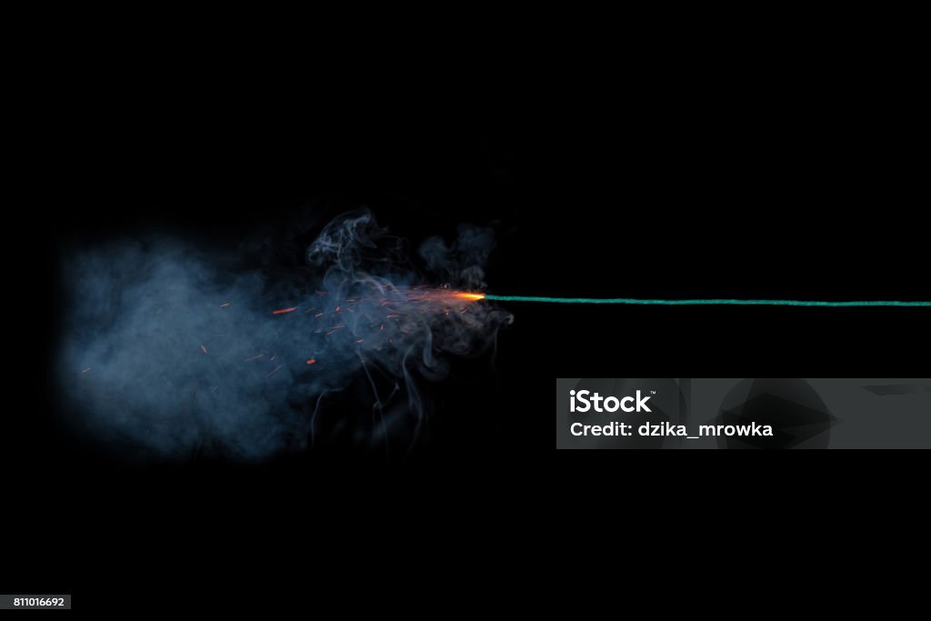 Long green fuse burning on black background isolated Explosive Fuse Stock Photo