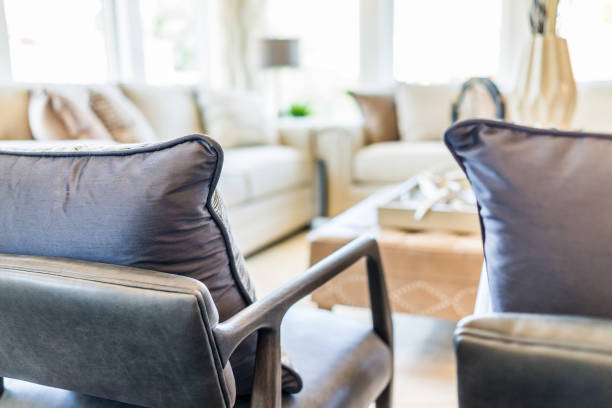 istock Modern living room with chairs and sofas, with many widows and bright natural light 811048334