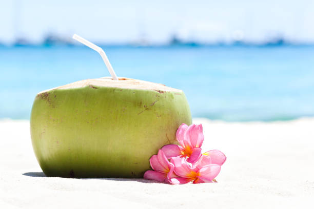 istock Tropical fresh cocktail on white beach 811053558