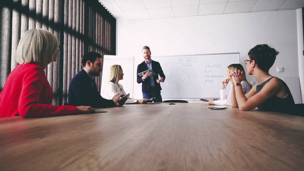 istock Business man presenting new ideas and projects to his team 811065540