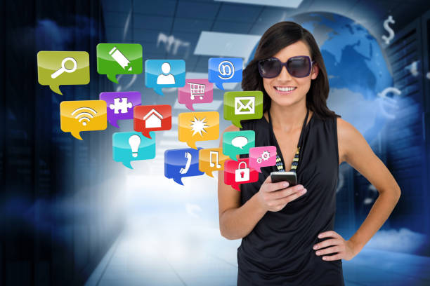 istock Glamorous brunette using smartphone with app icons 811081716