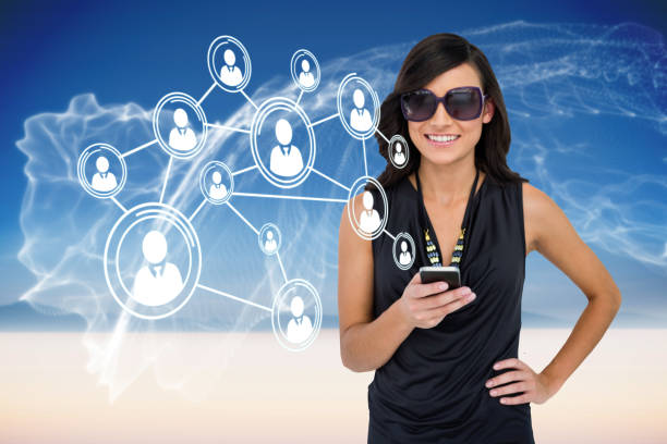 istock Glamorous brunette using smartphone with profile pictures 811083864