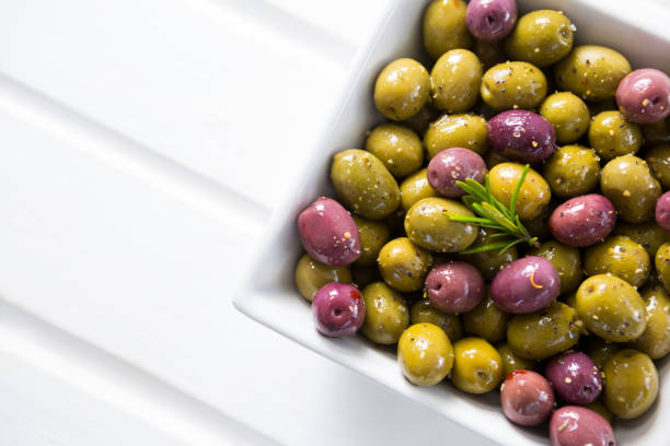istock Close-up of marinated olives in bowl 811084286