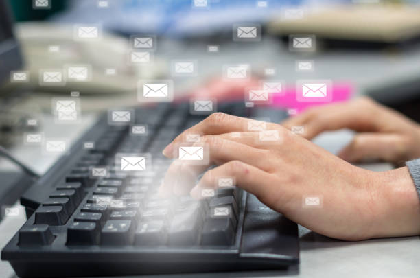 istock Many e-mail over the finger pressing the computer keyboard blurred background, business technology concept 811097484