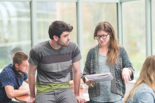 istock Multi-ethnic group of college students studying in conference room 811103446
