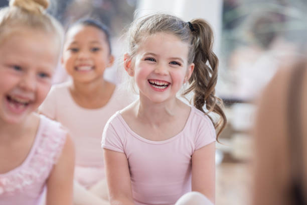 istock Young ballerina laughs at a joke before class 811106206