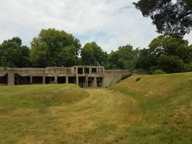 istock green grass hills with old abandoned cement buildings 811119266