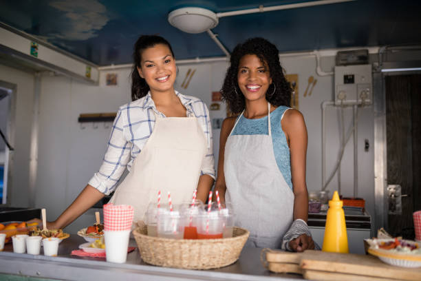 istock Portrait of waitress standing at counter 811124954