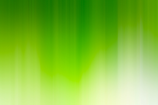 Bright colorful abstract blurry defocussed green background