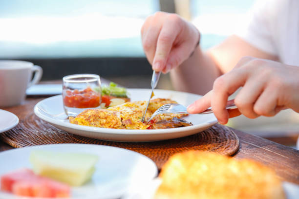 istock Adult men eating scrambled eggs and baked beans 811143794